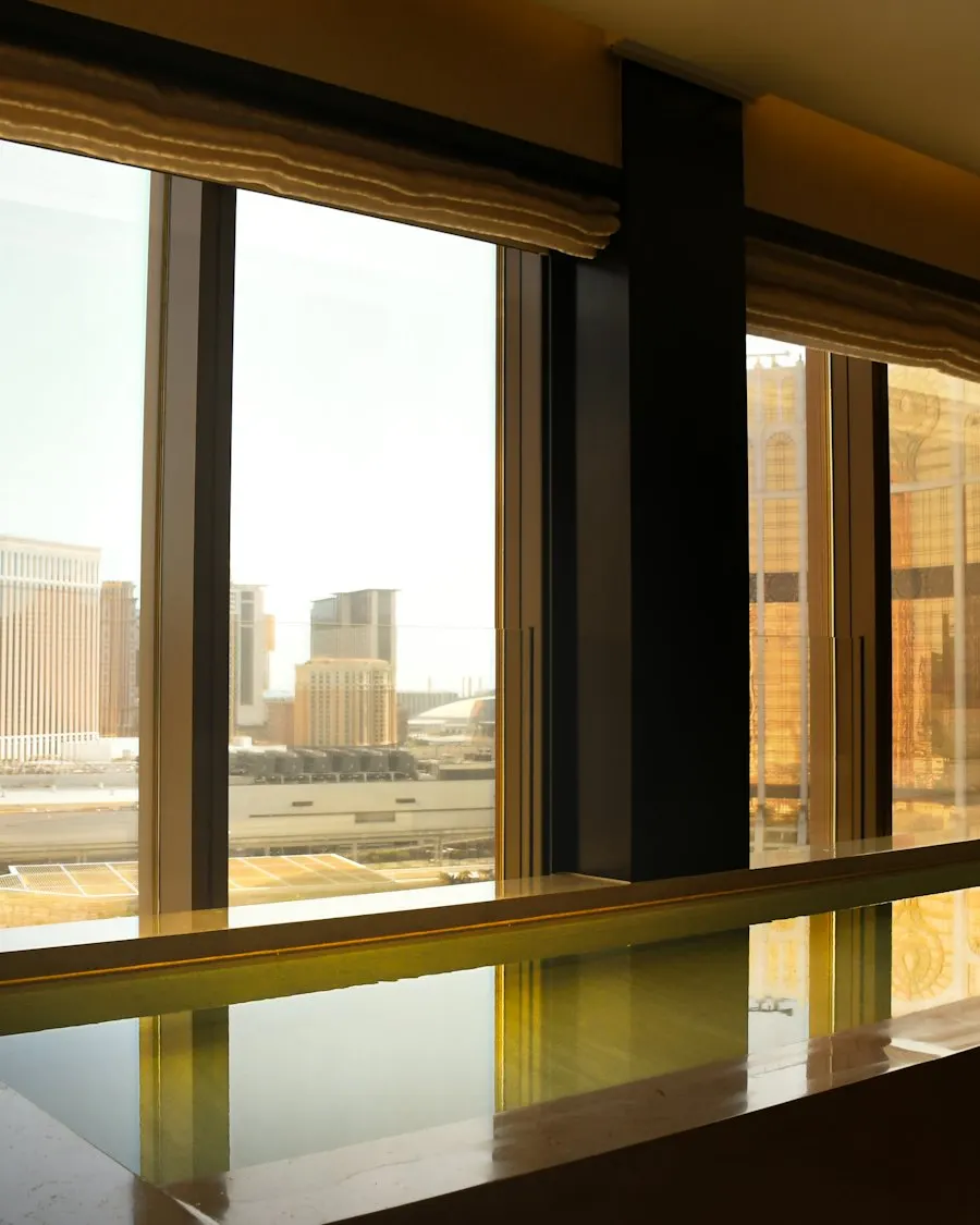 Hotel suite with a bathtub and floor-to-ceiling windows over the city