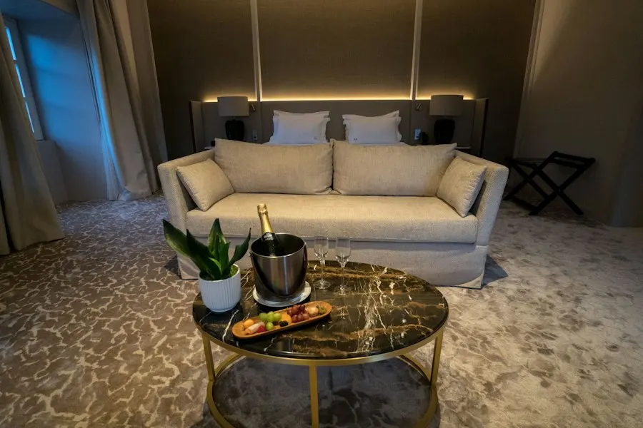 Hotel suite lounge with champagne on a marble table